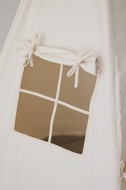 Nursery detail: close-up of the charming side window with roll-up curtain on a Moi Mili Beige Teepee Tent