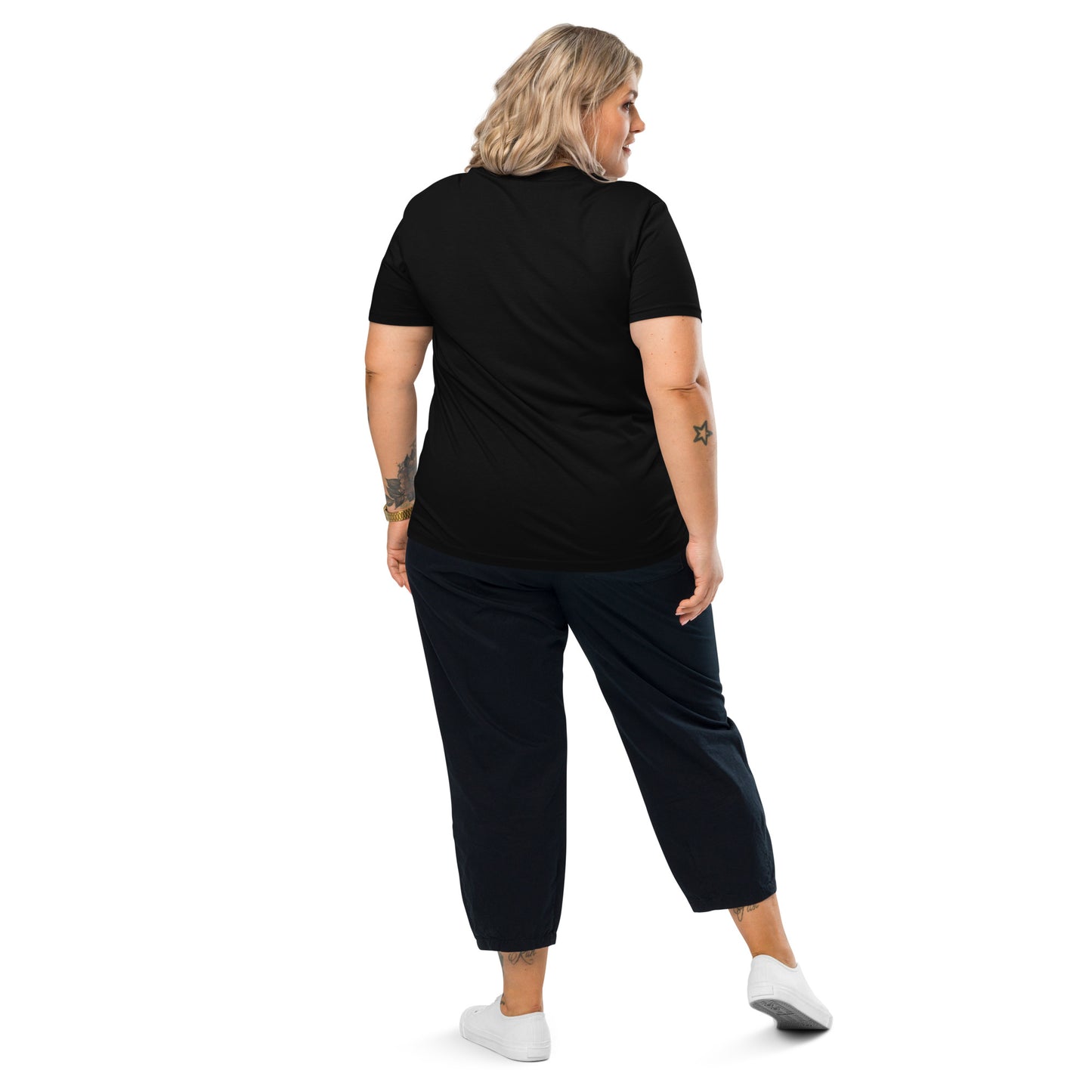 Back view of Woman wearing a black organic cotton t-shirt with the vintage cream MUM MODE ACTIVATED graphic, looking confident.