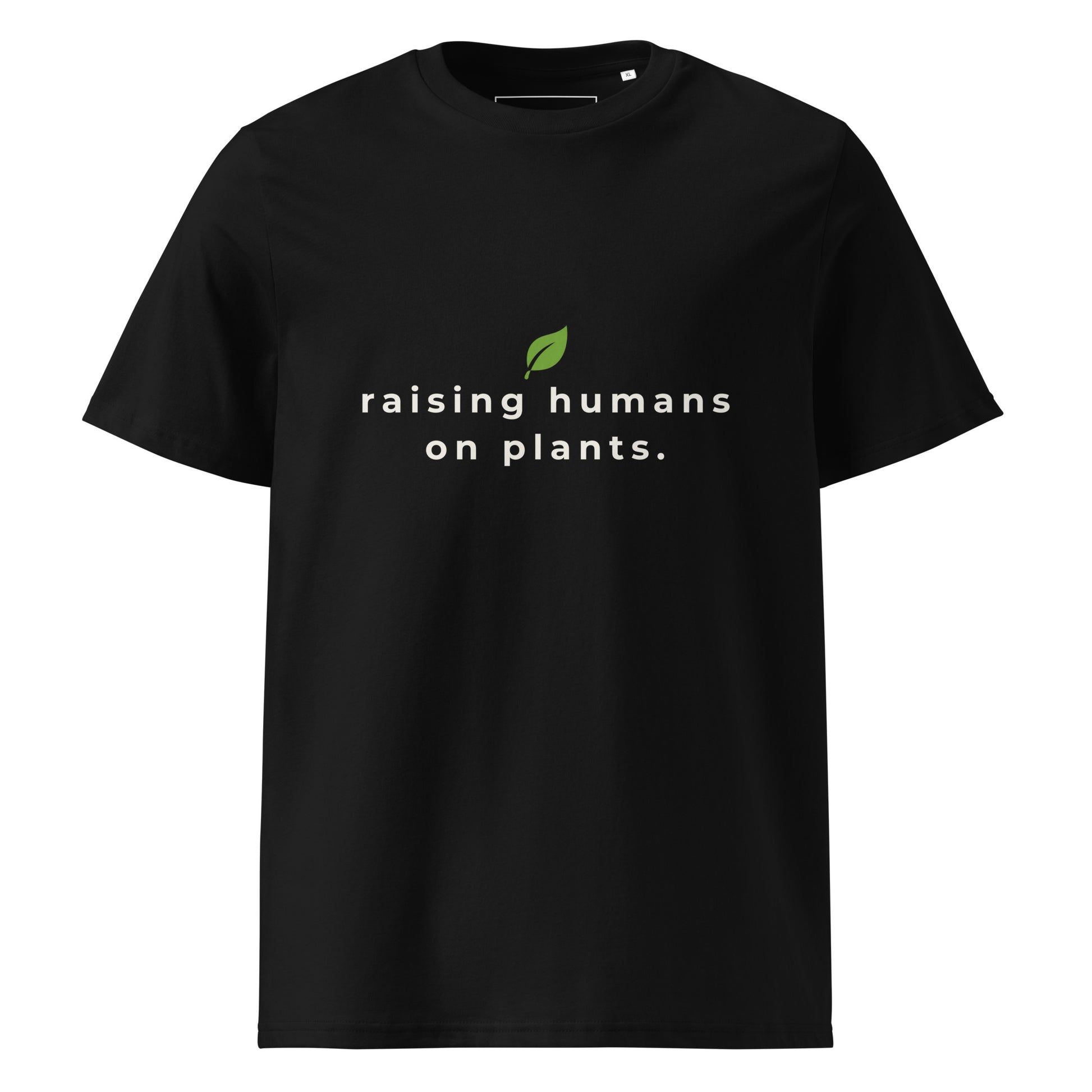Front flat lay of the "raising humans on plants." black t-shirt, showing the perfect alignment of the text and leaf logo on the chest.