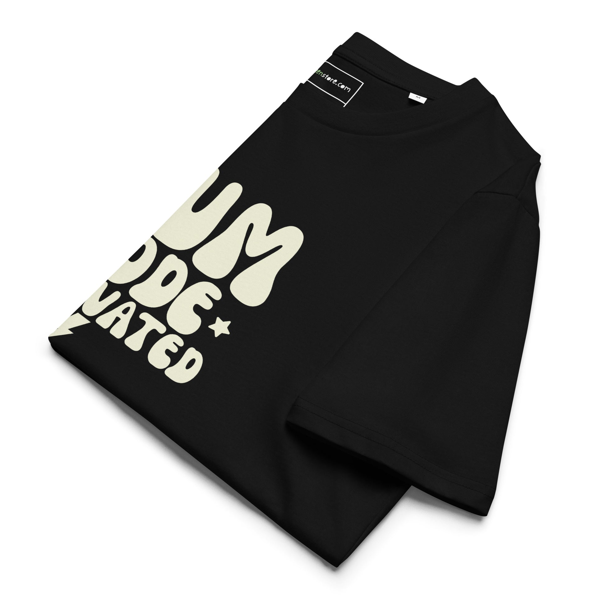 A folded black sustainable t-shirt showcasing the vintage cream MUM MODE ACTIVATED graphic and retro stars.