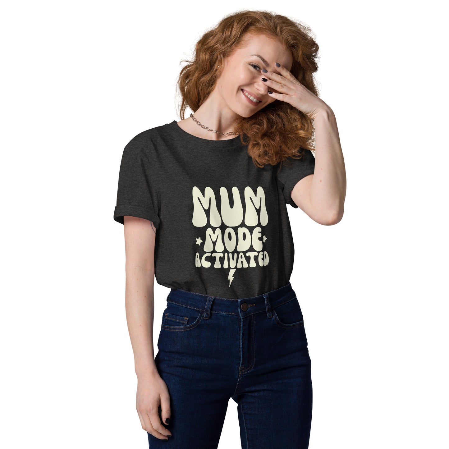 A woman casually modeling the vintage style dark grey heather t-shirt with the MUM MODE ACTIVATED graphic."