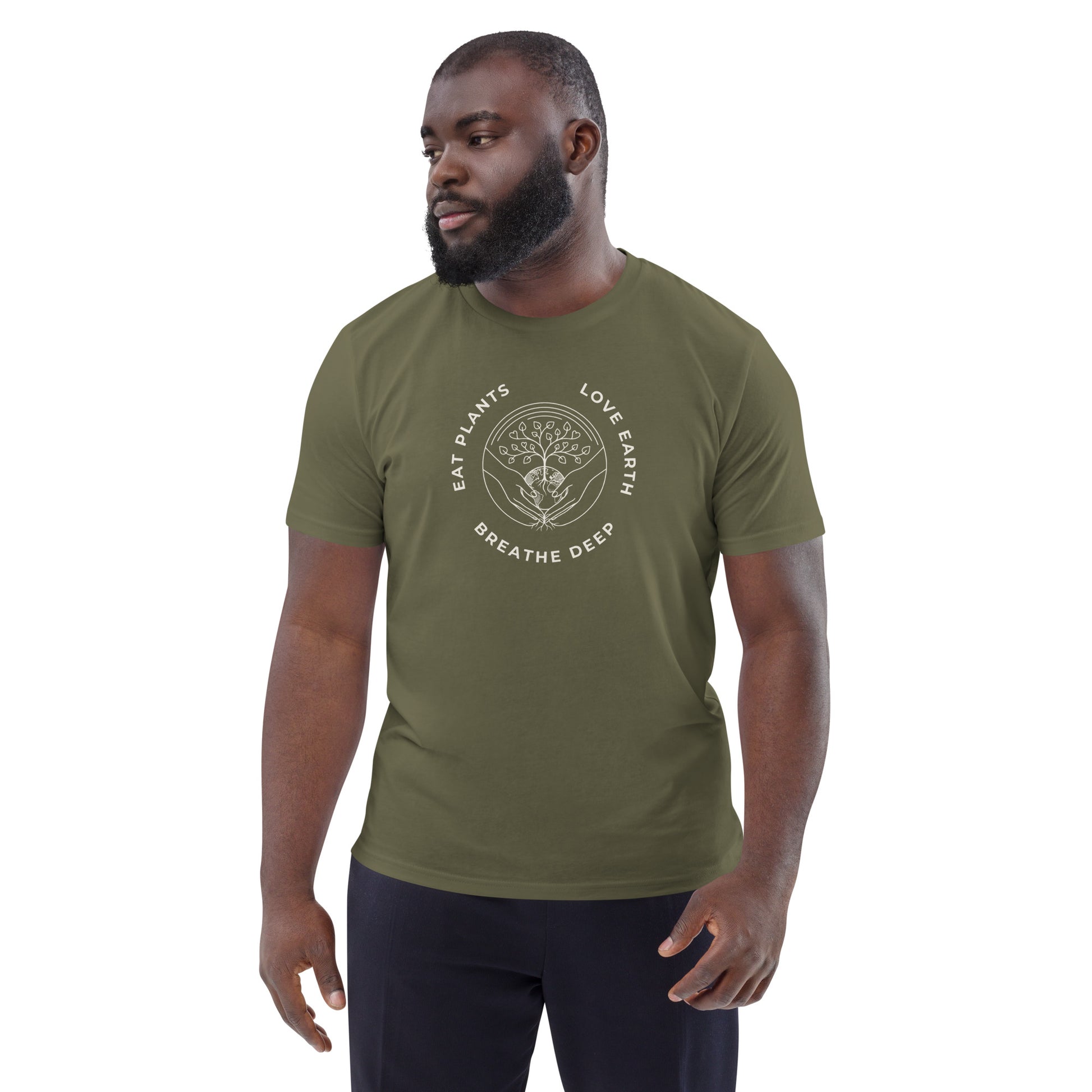 Male model wearing the unisex "Love Earth" organic cotton t-shirt in Olive Green, showing the minimalist tree and globe design and the comfortable medium fit