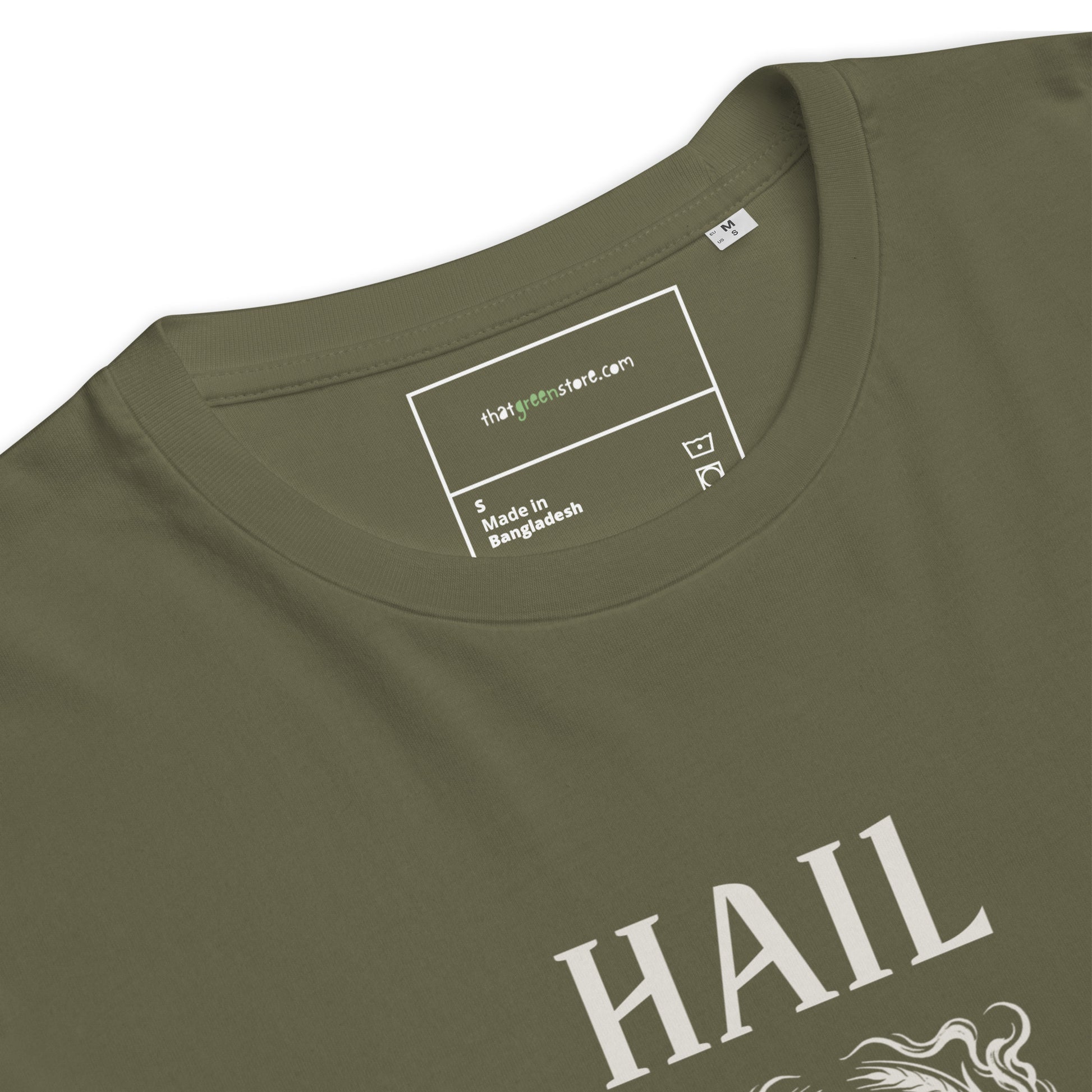 Close-up of the inner neck label on a Khaki organic cotton t-shirt, showing That Green Store branding above the ivory Hail Seitan graphic.