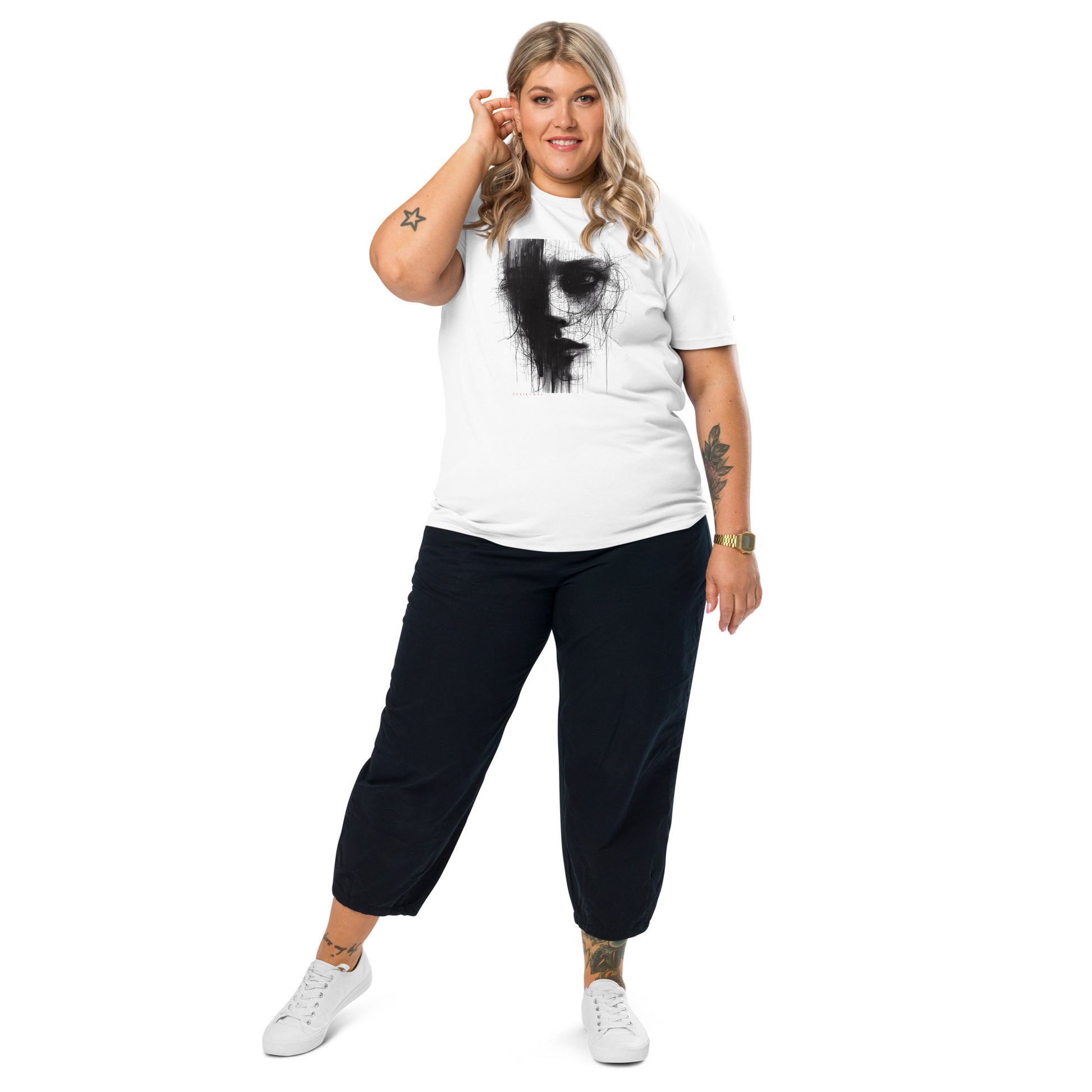 A female model wearing That Green Store 'Soliloquy' white organic t-shirt. The detailed charcoal graphic design and red text are centered on the torso, highlighting the medium fit.