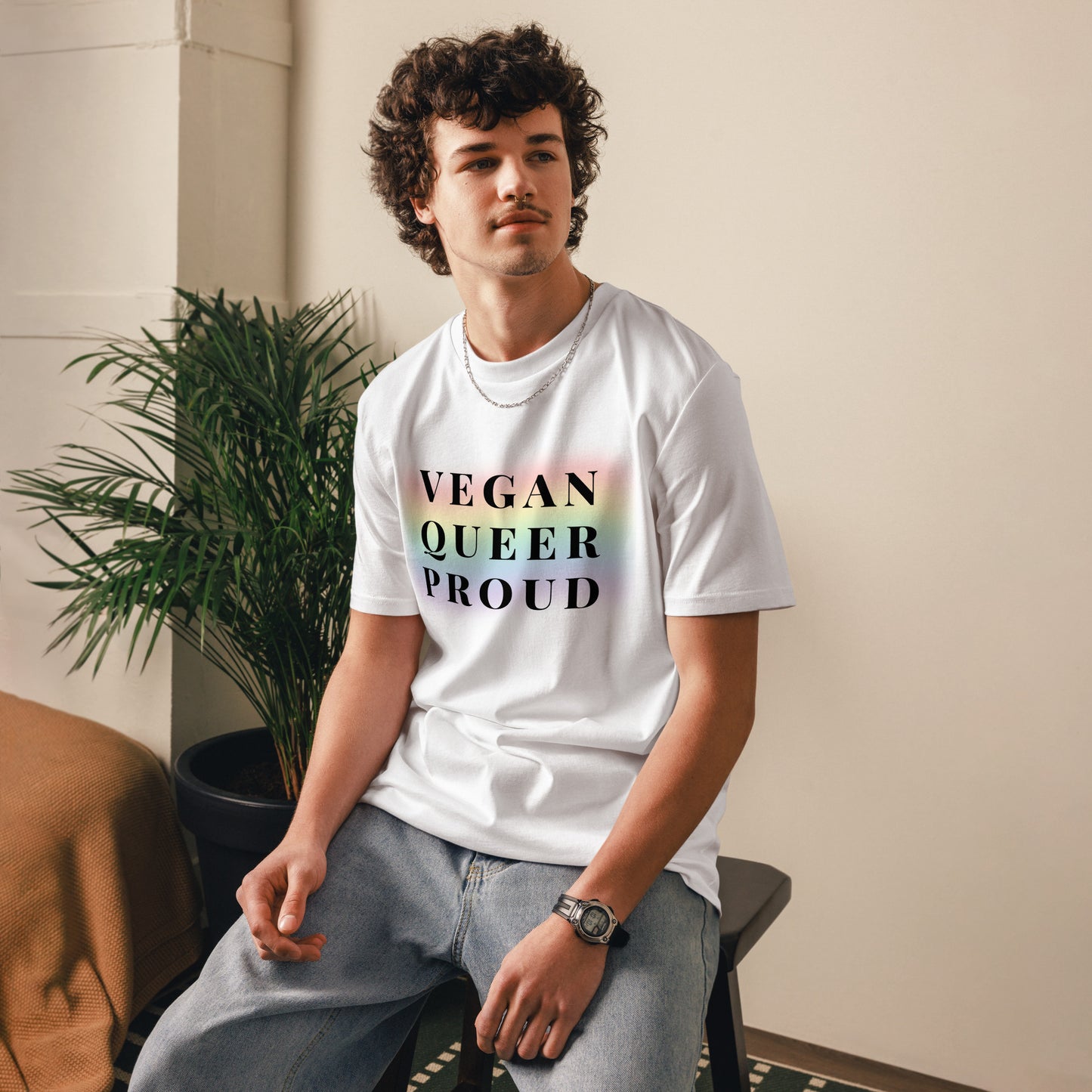 Male model wearing the Vegan queer pround organic cotton t-shirt, front view. white