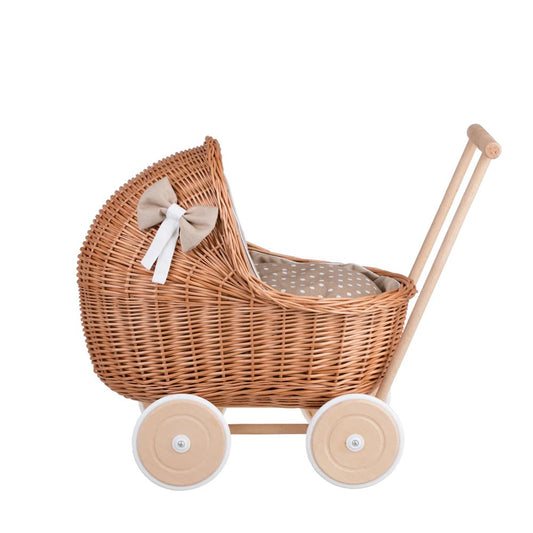 Side view Natural wicker doll pram Lili with beige bedding set