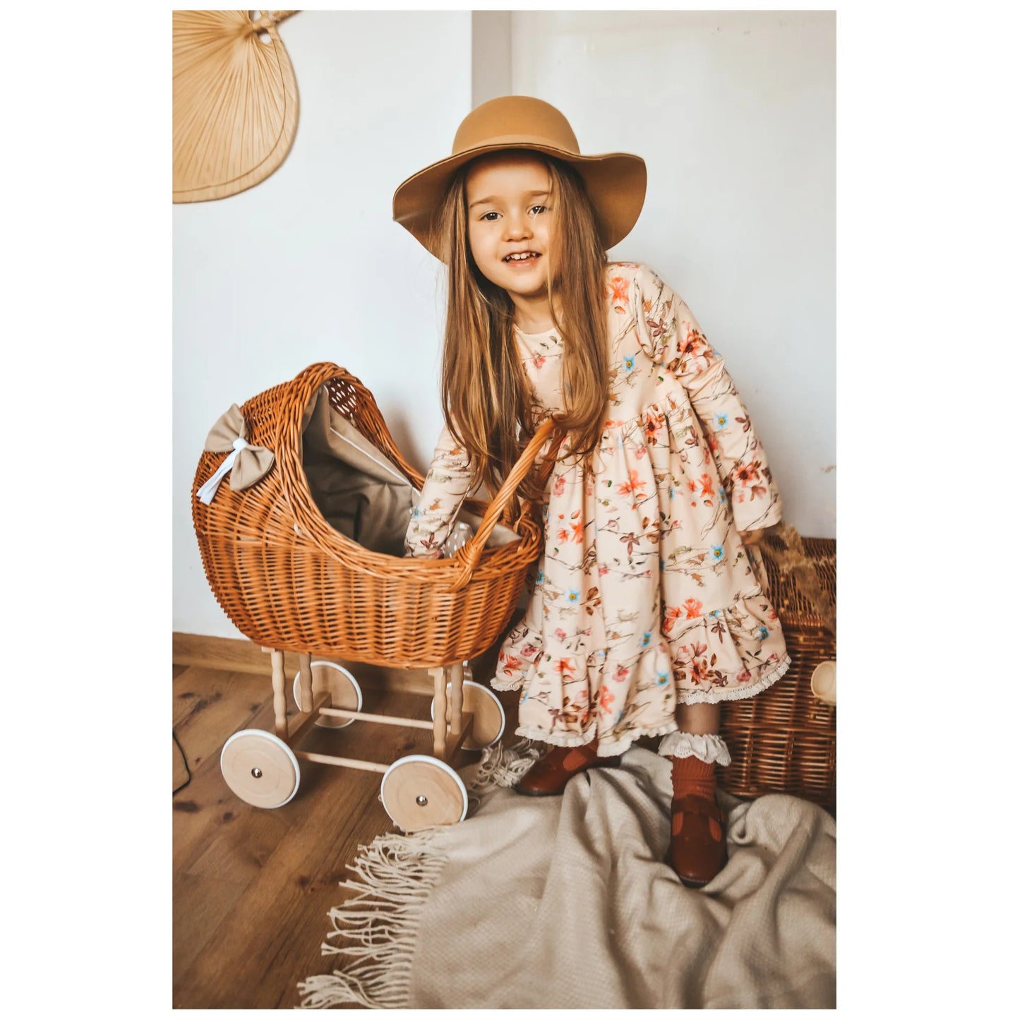 Kid playing  with Wicker Doll Stroller Lena – Beige Bedding