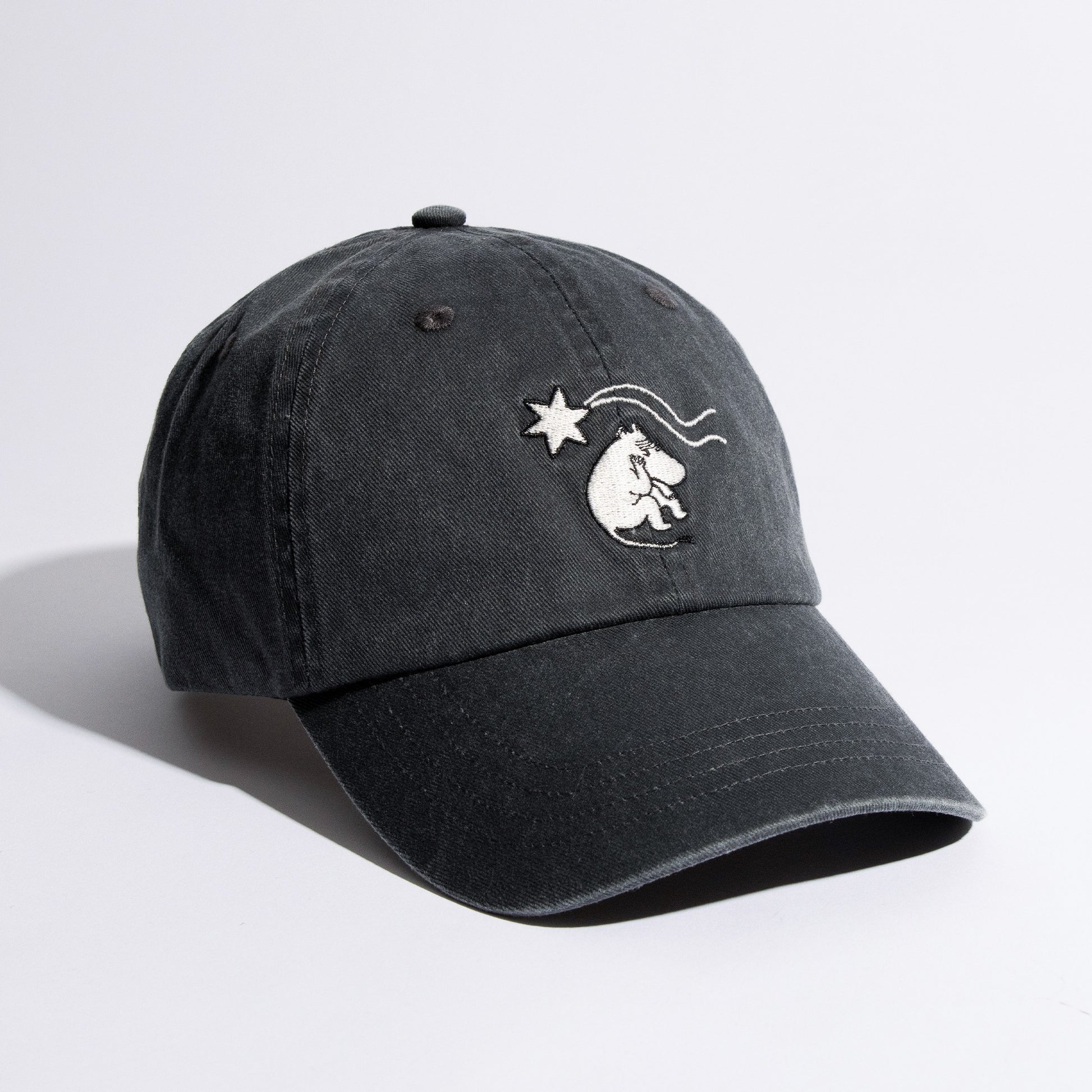 Black cap with a white logo on a light gray background